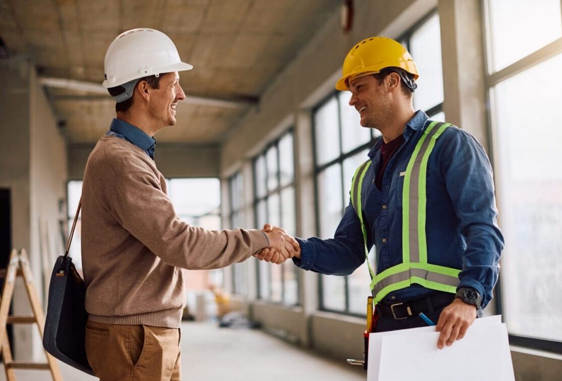 Subcontractor Prequalification - Contractor Shaking Hands With Subcontractor on a construction Work site.